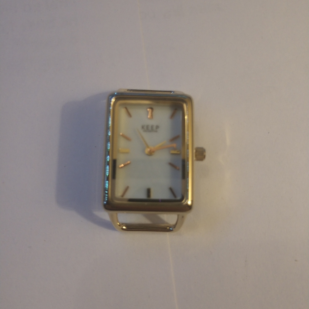 Keep Collective gold tank watch face